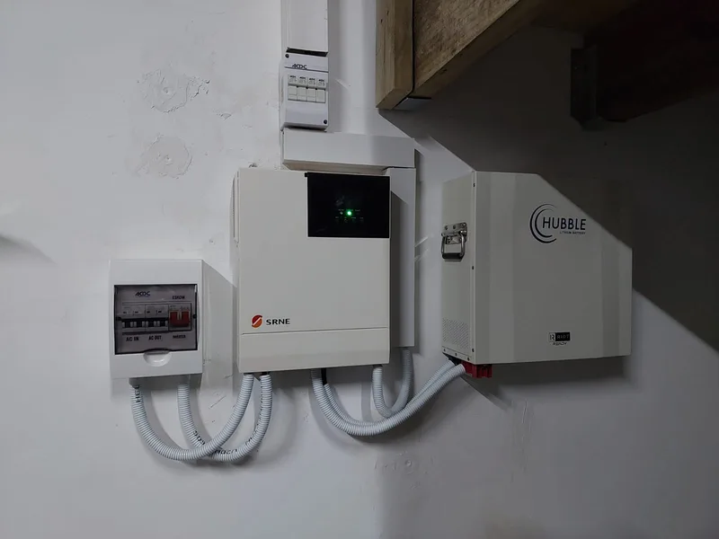 Wall-mounted inverter, battery and electrical distribution equipment.