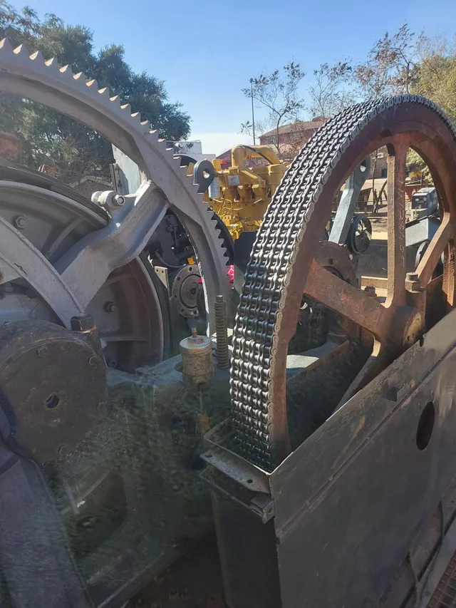 Exposed chain drive, large gears and yellow engine in the Bucyrus project.